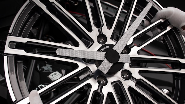 CNC-machined carbon fiber clock hands with ceramic bearings — TIQOSS precision detail